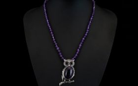Amethyst 'Owl' Pendant Necklace, a 35ct cabochon cut amethyst forming the body of the owl pendant