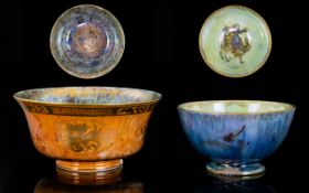 Two Wedgwood Fairyland Lustre Bowls The first in orange glaze with gilt butterfly decoration