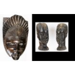 A Collection Of Carved African Objects Three items in total to include ebonised wood wall mask
