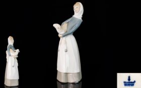 Lladro Figure 'Girl with Lamb' design by sculptor Alfredo Ruiz, issued 1969. Height 10.