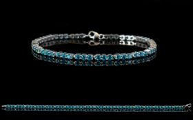 Swiss Blue Topaz Tennis Bracelet, a continuous row of round cut, vibrant,