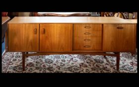 A Mid-Century Teak Sideboard of large proportions with double cupboard,