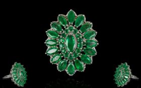 Emerald Marquise Shape Cluster Ring, a raised central marquise cut .