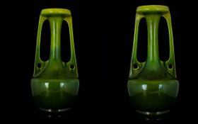 A Pair Of Bretby Art Nouveau Twin Handle Vases Each in moss green ombre glaze with everted rim