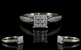 A 9ct White Gold Diamond Cluster Ring Set with 9 brilliant cut diamonds,