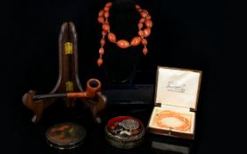 A Small Mixed Lot to include coral necklace, black lacquered box, bead necklace, ladies pipe,