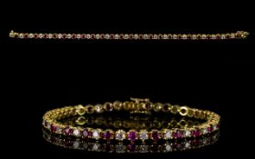 18ct Gold Diamond Tennis Bracelet Set with alternating round modern brilliant cut diamonds and