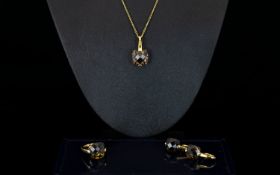 A Contemporary Silver Vermeil And Smoky Topaz Jewellery Suite Comprising pendant necklace, wired