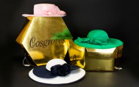 Three Cosgroves Hats in Two Hatboxes, one in emerald green with decorative bow,