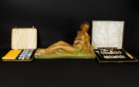 Art Deco Chalkware Figure Raised on rectangular plinth,