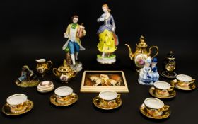 A Small Box Of Ceramics And Figures A varied collection to include gilt trim tea set,