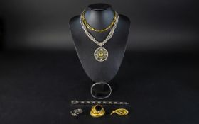 A Mixed Collection Of Costume Jewellery Items To include gold tone 1950's brooch with large glass