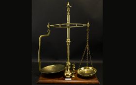A Pair Of Brass Pan Scales - With Weights. Marked Agate Balance. Height 20 Inches.