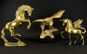 A Collection Of Brass Ornaments Comprising bird of prey, unicorn and prancing horse.