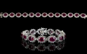 Ruby and Natural White Zircon Line Bracelet, 34cts of oval cut rubies framed with round cut