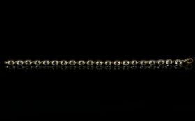 White Topaz And Gold Plate Contemporary Tennis Bracelet The whole in silver, finished with gold