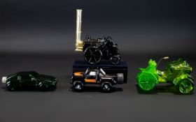 A Collection Of Four Novelty Avon Scent Bottles Each modelled in the form of a vehicle.