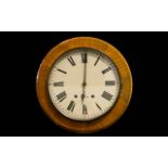 Antique Wall Mounted Clock Circular clock in golden oak case with white enamel dial and black Roman