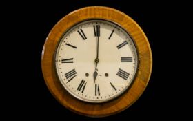 Antique Wall Mounted Clock Circular clock in golden oak case with white enamel dial and black Roman