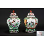 A Pair Of Oriental Lidded Ginger Jars Finished with floral enamel decoration and figurative