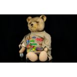 Well-loved vintage Growler Teddy Bear with moveable arms, head and legs, glass eyes,