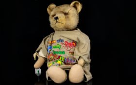 Well-loved vintage Growler Teddy Bear with moveable arms, head and legs, glass eyes,