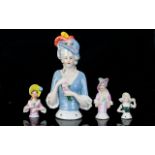 Ceramic Half Boudoir Doll Along With Three Miniature Examples Early 20th century half doll in