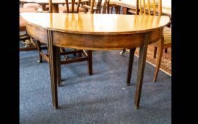 A Crescent Shaped Console Table.