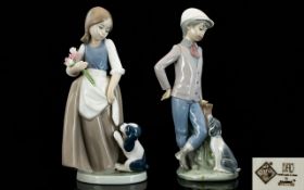 Nao by Lladro Pair of Porcelain Figurines ( 2 ) In Total. Comprises 1/ Boy and Puppy.