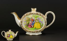 A Musical Teapot By Sadler Ceramic teapot with gilt trim throughout and figurative panel bordered