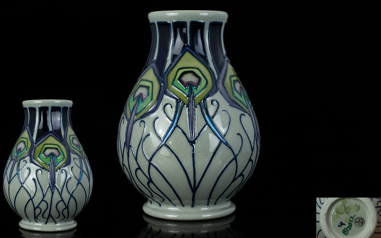 Moorcroft - Small Tube lined Vase - Peacock Parade Design. Designer Nicola Slaney. Date 2012.