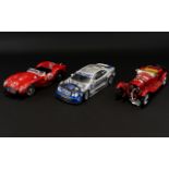 A Collection Of Die Cast Models Three in total to include Maisto Mercedes Benz, Burago Ferrari,