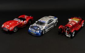 A Collection Of Die Cast Models Three in total to include Maisto Mercedes Benz, Burago Ferrari,