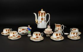 A Japanese Porcelain Coffee Set comprising 6 cups and saucers, milk jug and sugar bowl.