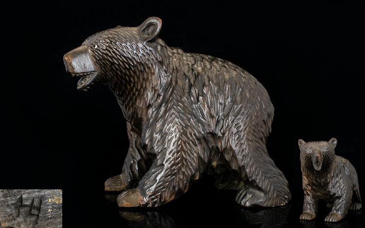 A Black Forest Carved Wood Bear with Bea