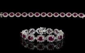 Ruby and Natural White Zircon Line Bracelet, 34cts of oval cut rubies framed with round cut