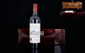 A Cased Bottle Of Chateau Chevrol Bel Air 2002 Housed in hardwood case, complete with bartools.