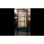 A Late 19th/Early 20th Century Display Cabinet raised on square legs, with glazed front and sides.