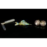 A Mixed Lot Containing articulated enameled fish, a pair of novelty cufflinks in the form Roulette