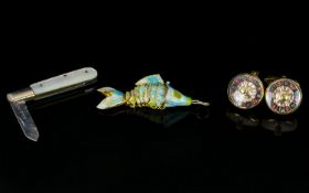 A Mixed Lot Containing articulated enameled fish, a pair of novelty cufflinks in the form Roulette