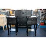 A Suite of Bedroom Furniture in matte black contiboard with garland decoration in the French style,