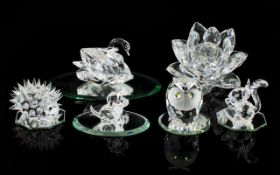 A Collection Of Swarovski Crystal Items To include, candle holder in the form of a waterlily bloom,