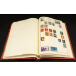 Red springback Movaleaf stamp album full of world wide stamps.