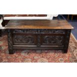An 18th Century Carved Coffer Of large proportions,