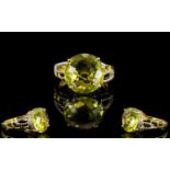 Ouro Verde Green Gold Quartz Solitaire Ring, a 7.5ct round cut green gold quartz with chequerboard