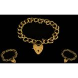 9ct Gold Heavy Curb Bracelet with Attached 9ct Gold Shield Shaped Padlock and Safety Chain.