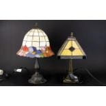 Two Tiffany Style Stained Glass Short Table Lamps Each raised on reproduction art nouveau cast