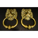 A Pair of Brass Door knockers traditional lion mask brass door knockers each with aperture for