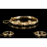 A 9ct Gold Hinged Bangle Bamboo effect design, fully hallmarked, 12 grams in weight,