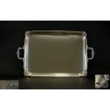 Victorian Period Good Quality and Heavy Twin Handle Silver Tray profusely decorated to borders and